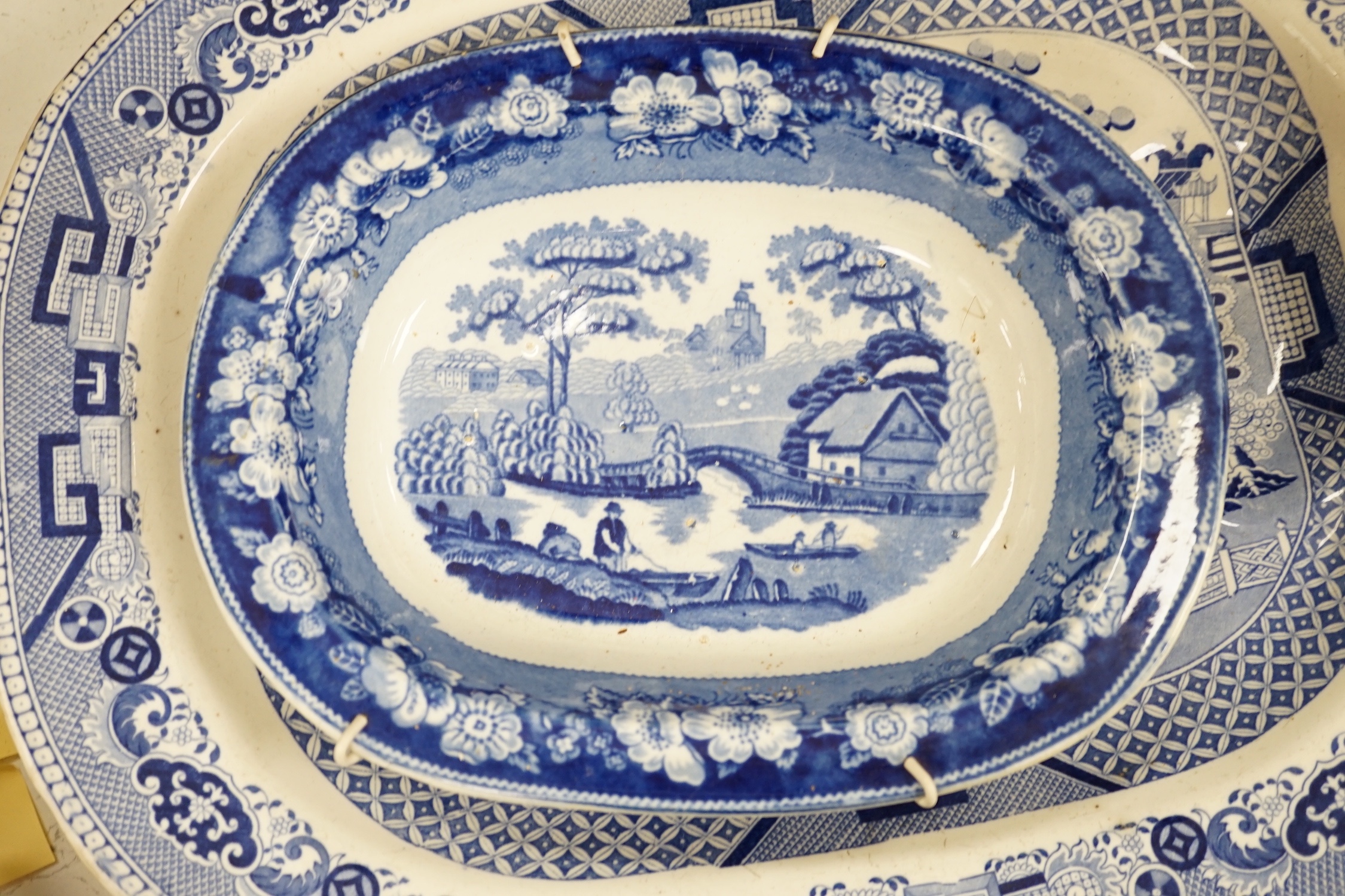 A 19th century blue and white meat platter and four similar dishes